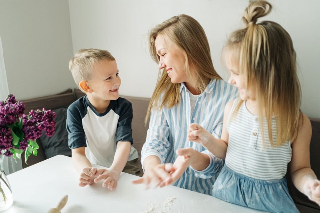 pexels-photo-4783976-4783976 A mother and her two children enjoy a fun baking session inside their home.